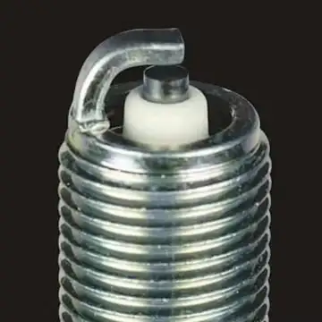 Clean spark plug with restored electrode